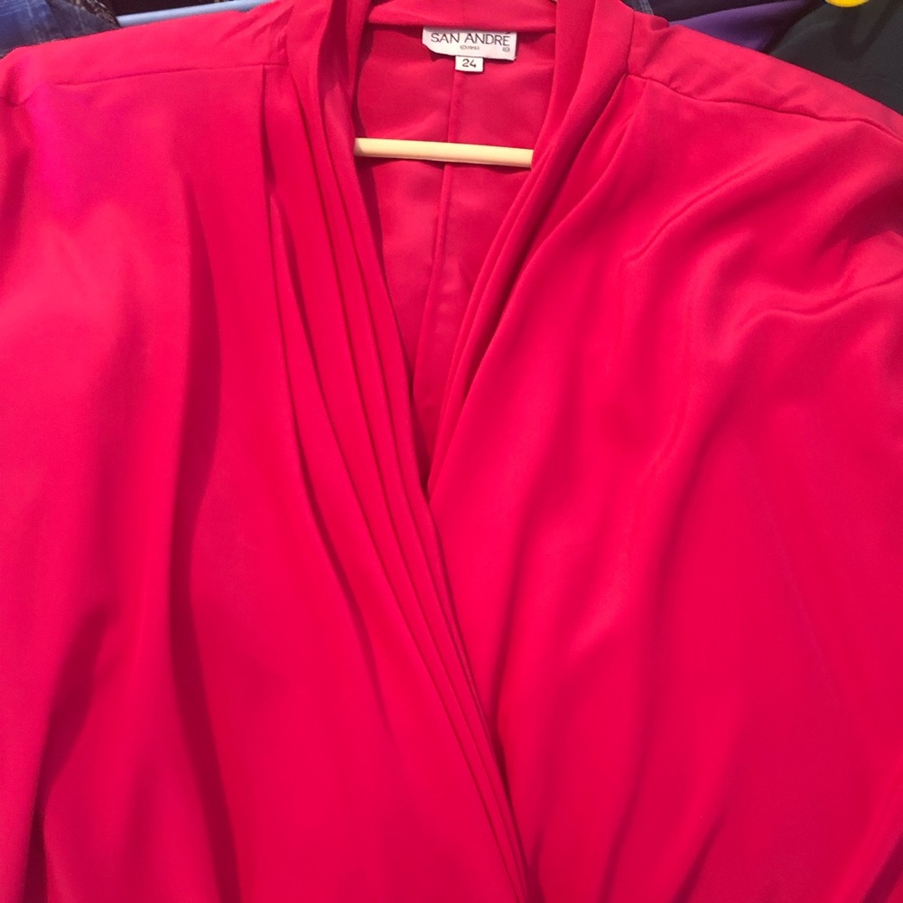 This blouse in a nice shade of pink and will add a dressy touch to one’s outfit.